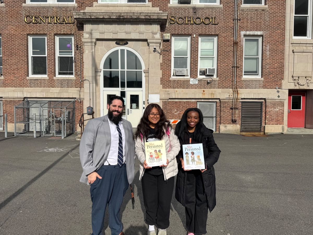 Outside Central School with student readers