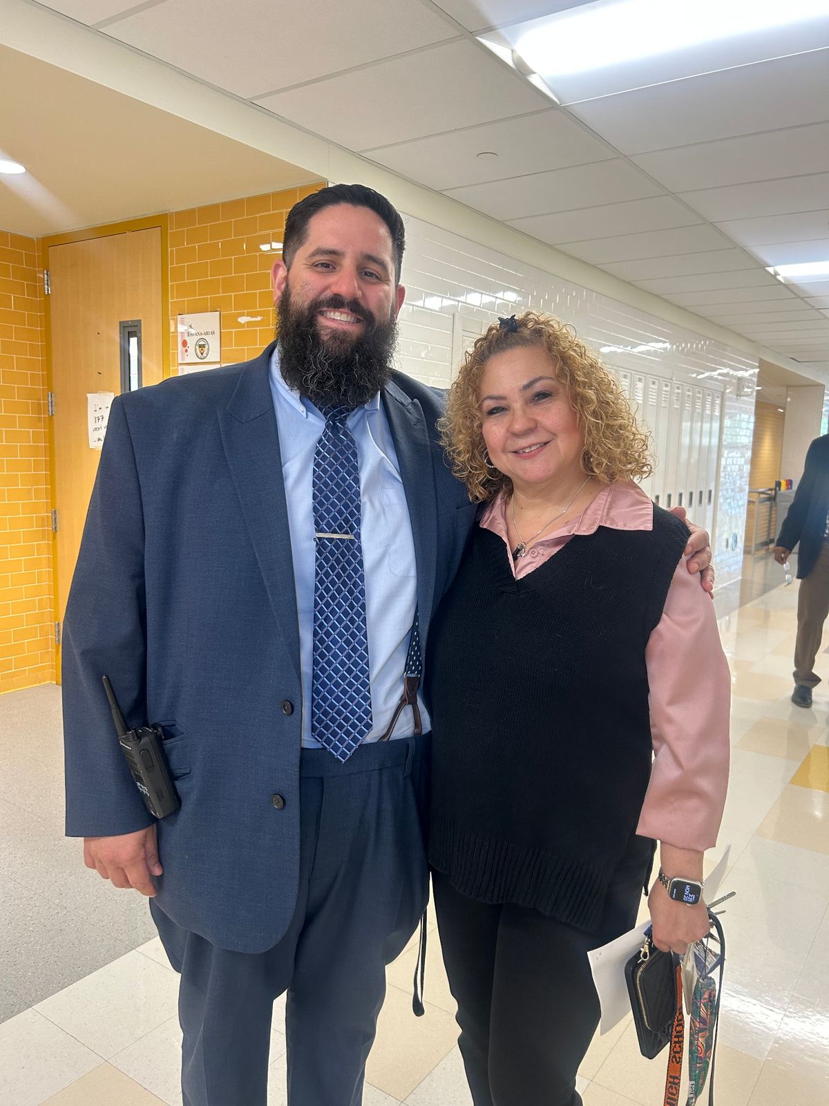 Dr. López with a school support staff member