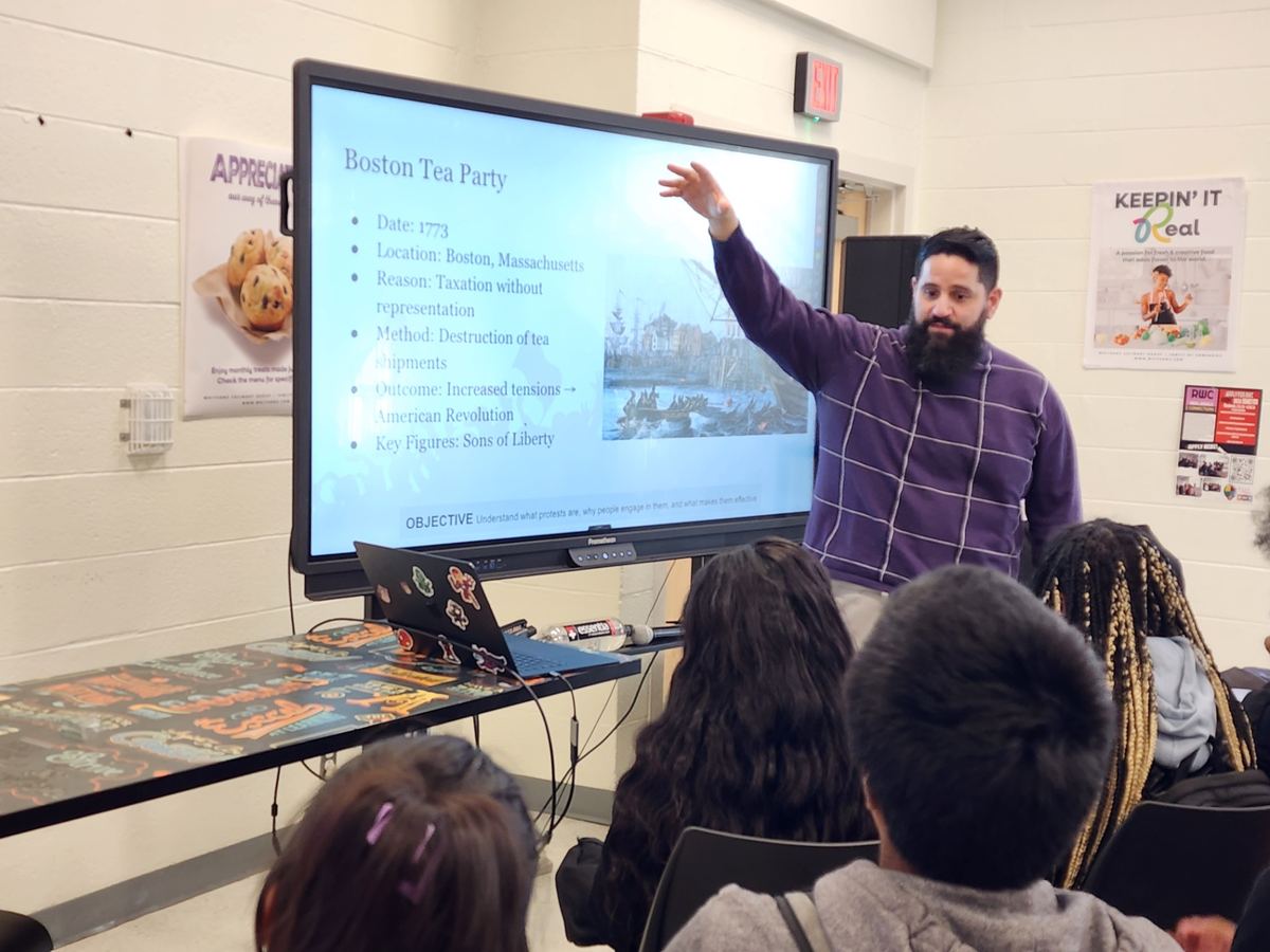 Close-up of Dr. López teaching a history lesson